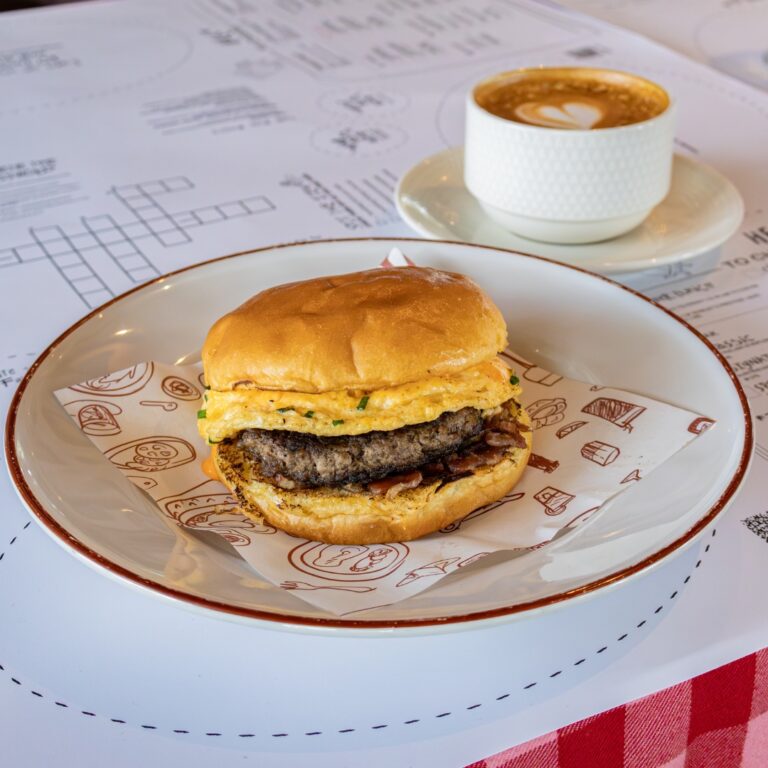 The Egg Bun breakfast sandwich with bacon and spicy mayo at Rowley's DIFC